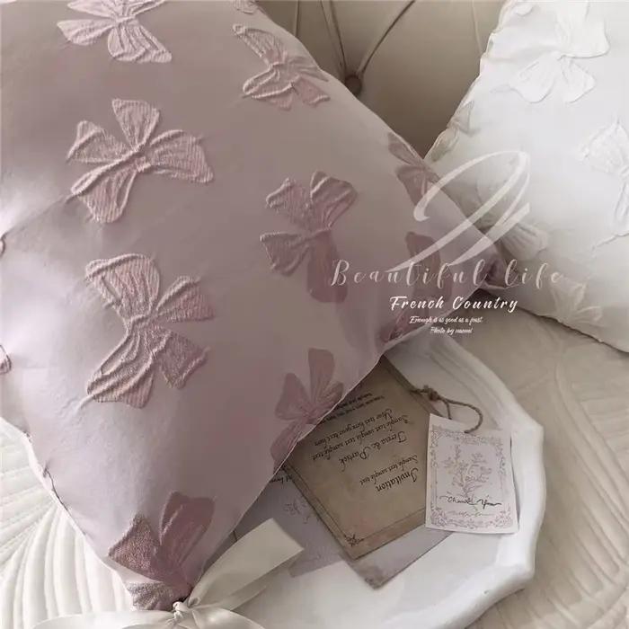 Taie d'oreiller Jacquard avec nœud rose