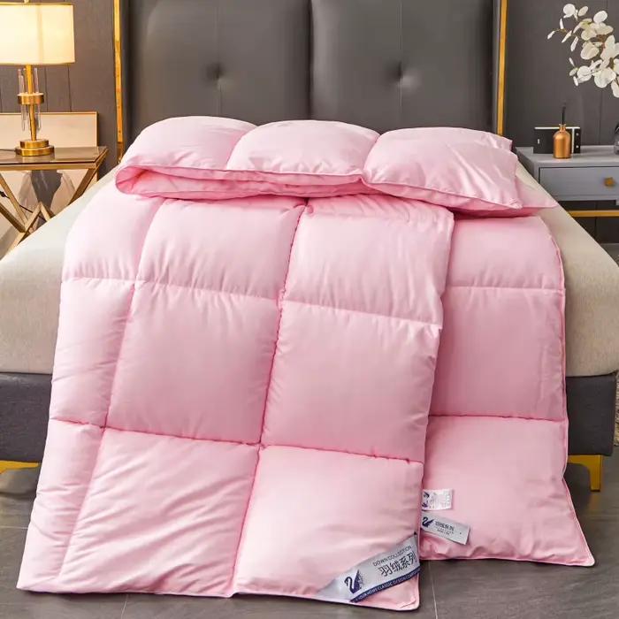 Couette en duvet d'oie blanche comme rembourrage