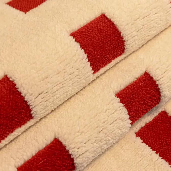 Coussin de canapé en peluche à carreaux irréguliers