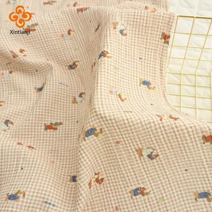 Tissu en gaze de coton double couche doux et respirant pour couverture de couette
